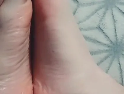 Guy Gently Massages His Feet with Oil