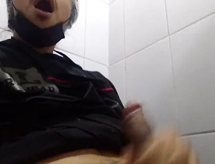 Man Sits in the Bathroom