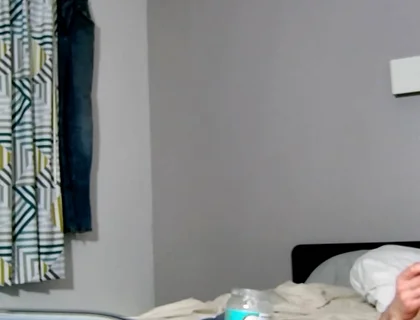 On Bed Laying Down with Socks and Beater on