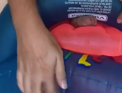Playing with inflatable swim ring