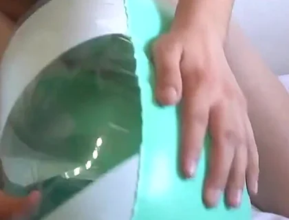 Playing with a Green and White Swimring