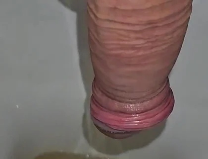 Male Peeing Into the Toilet