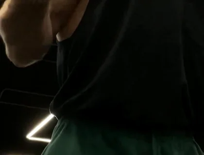 Doing a Biceps Curls with a Straight Barbell