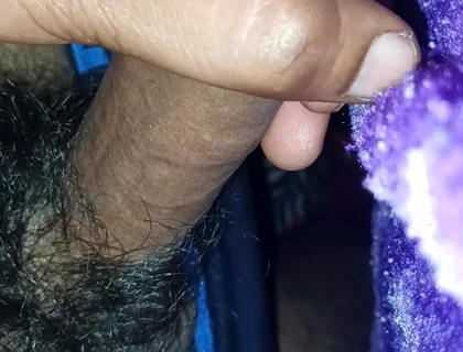 A Indian Young Boy Is Playing with His Penis Inside a Blanket