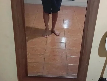 Boy in Shorts in the Mirror