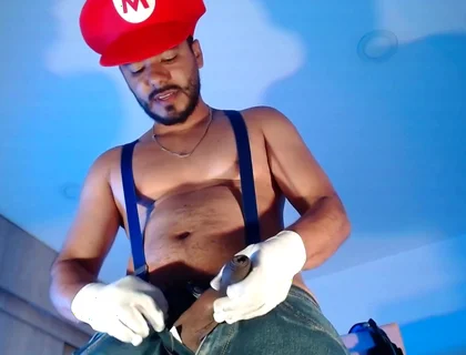 Dressed as Mario Bros Playing with His Plumbing Tool