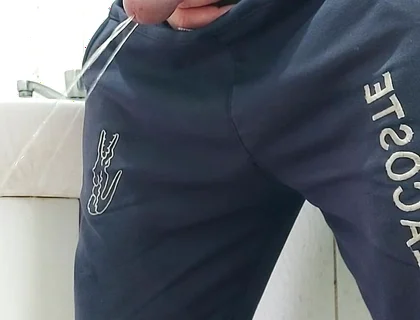 A Well-endowed Brazilian Man Urinating and Showing His Thick Penis to His Female Friends.