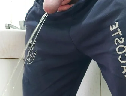 A Well-endowed Brazilian Man Urinating and Showing His Thick Penis to His Female Friends.