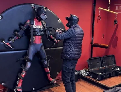 Pup Twink Dressed as Spider-man Strapped to the Bondage Wheel and Milked