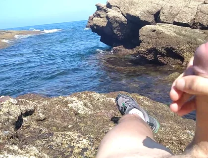 Jerking off a Big Hard Dick Overlooking the Sea in the Beach Cove Until He Cums