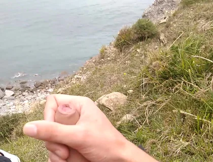 Big Beautiful Big Fat Cock Gets Handjob on the Beach with Gorgeous Sea Views