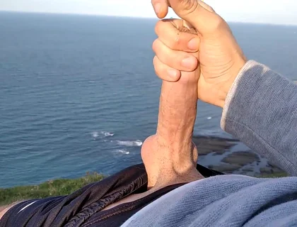 Huge Dirty Cock Gets Handjob on the Beach and Squirts a Lot of Thick Sperm in Front of the Beach