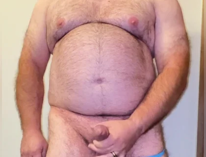 Anal Steve in His Blue Thong Showing off His Bear Body and Cock, with a Cock Ring on and Showing His Massive Butt Plug