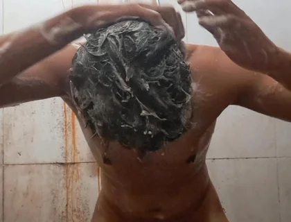 Exotic Skinned Adult Man Taking a Bath in the Afternoon