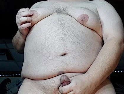 Chubby Guy Stands and Cums