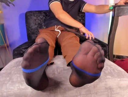 College Teacher Relaxes on the Sofa at Home with His Feet on the Furniture so He Can Love Them