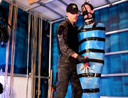 Twink Slave Bound in Pallet Wrap for Orgasm Control