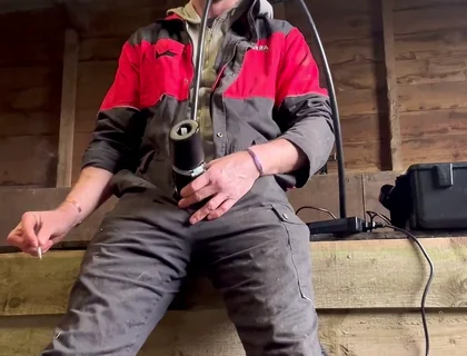Farmer Smokes and Milks Himself with the Milking Machine