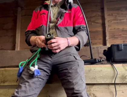 Farmer Smokes and Milks Himself with the Milking Machine