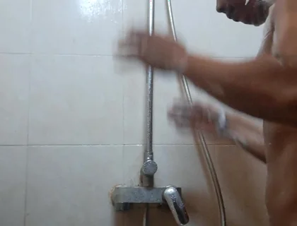 Exotic Skinned Asian Adult Man Taking a Shower in the Morning