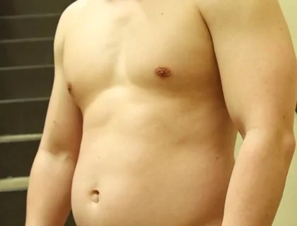 Flexing by the Stairs at the Gym