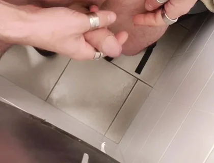 Jerking off a Cock in a Public Toilet